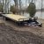 New 25' 10K Load Trail Deck over W/Self Clean Dove And Flip Over Ramps - $5399 - Image 1